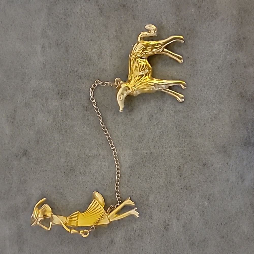Dog walking brooch